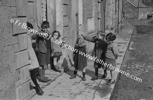 CHILDREN PLAYING IN STREET